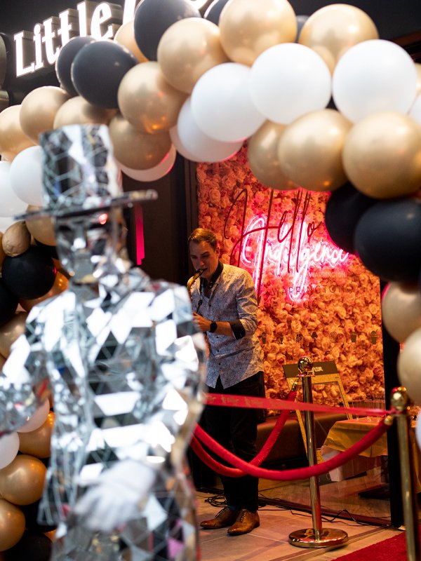 Little Dessert Shop Warrington Store Opening With Mirror men dancing in-front of the shop with a saxophonist.